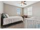 Bright bedroom with natural light, plush carpet, and an overhead fan, offering a serene living space at 2237 S Jacana Ln, Gilbert, AZ 85295