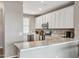 Well-lit kitchen features marble countertops, modern appliances, and plenty of storage at 2237 S Jacana Ln, Gilbert, AZ 85295
