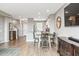 Bright and airy kitchen with a dining area, white cabinetry, and stainless steel appliances at 2237 S Jacana Ln, Gilbert, AZ 85295