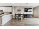 Open kitchen and dining area with stainless steel appliances and modern finishes at 2237 S Jacana Ln, Gilbert, AZ 85295