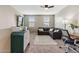 Upstairs living space with TV, carpet, ceiling fan, desk, and a comfortable couch at 2237 S Jacana Ln, Gilbert, AZ 85295