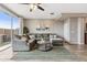 Bright living room with a comfortable sectional sofa and access to the backyard at 2237 S Jacana Ln, Gilbert, AZ 85295