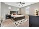 Comfortable primary bedroom features neutral colors, a ceiling fan, and plush carpet at 2237 S Jacana Ln, Gilbert, AZ 85295