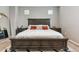 Inviting primary bedroom with a plush bed, side tables, carpet, and neutral paint at 2237 S Jacana Ln, Gilbert, AZ 85295