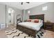 Spacious primary bedroom with a large bed, soft carpet, and a full-length mirror at 2237 S Jacana Ln, Gilbert, AZ 85295