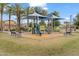 Community playground featuring a slide and shaded play area for neighborhood  at 2237 S Jacana Ln, Gilbert, AZ 85295