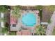 Aerial view of a community pool with lounge chairs, umbrellas and shade structures at 2237 S Jacana Ln, Gilbert, AZ 85295