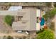 Aerial view of a home, showcasing the pool, fire pit, patio and desert landscaping in backyard at 2239 N Calvin --, Mesa, AZ 85207