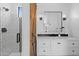 Modern bathroom with white vanity, sleek black hardware, and a stylish shower with subway tile at 2239 N Calvin --, Mesa, AZ 85207