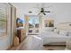 Bright bedroom featuring hardwood floors, a ceiling fan, and doors that provide seamless outdoor access at 2239 N Calvin --, Mesa, AZ 85207
