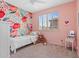 Adorable bedroom with floral wallpaper, a twin bed, and natural light from the shuttered window at 2239 N Calvin --, Mesa, AZ 85207