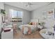 Cozy bedroom featuring a comfortable bed, desk, and decor at 2239 N Calvin --, Mesa, AZ 85207