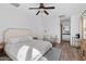 Inviting bedroom featuring a ceiling fan, cozy seating area, and modern decor elements at 2239 N Calvin --, Mesa, AZ 85207