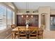 Dining area showcasing a wooden table and chairs, complemented by overhead lighting and built in dark wood storage at 2239 N Calvin --, Mesa, AZ 85207