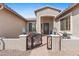 Charming home featuring an inviting entry with a decorative wrought iron gate and a cozy sitting area at 2239 N Calvin --, Mesa, AZ 85207