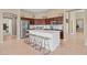 Spacious kitchen featuring a large island, stainless steel appliances, and dark wood cabinetry at 2239 N Calvin --, Mesa, AZ 85207