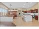 Spacious kitchen with a large island, stainless steel appliances, and an adjacent dining area at 2239 N Calvin --, Mesa, AZ 85207