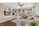 Open-concept living room with a fireplace, tile floors, and lots of natural light at 2239 N Calvin --, Mesa, AZ 85207