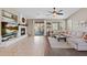 Cozy living room with a fireplace, a ceiling fan, and sliding glass doors leading to the backyard at 2239 N Calvin --, Mesa, AZ 85207