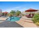 Backyard oasis featuring a sparkling pool, desert landscaping, and a large lounge area at 2239 N Calvin --, Mesa, AZ 85207