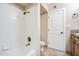 Bathroom with tile flooring, a bathtub and shower combo, and a wood vanity at 2329 W Keating Ave, Mesa, AZ 85202