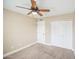Bedroom with carpet, closet, a ceiling fan, and neutral paint at 2329 W Keating Ave, Mesa, AZ 85202