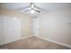 Bedroom features carpet, closet, a ceiling fan, and neutral paint at 2329 W Keating Ave, Mesa, AZ 85202