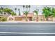 Inviting single-story home with desert landscaping and a red tile roof, enhanced by mature trees at 2329 W Keating Ave, Mesa, AZ 85202