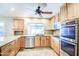 Modern kitchen featuring stainless steel appliances, granite countertops, and ample natural light at 2329 W Keating Ave, Mesa, AZ 85202