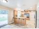 Inviting kitchen featuring custom cabinets, granite countertops, an island bar and backyard access at 2329 W Keating Ave, Mesa, AZ 85202