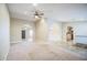 Expansive living room showcasing neutral carpet, arched doorways, tile flooring, and ample space for gatherings at 2329 W Keating Ave, Mesa, AZ 85202