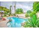 Inviting swimming pool surrounded by lush landscaping and featuring rocks, perfect for relaxation and recreation at 2329 W Keating Ave, Mesa, AZ 85202
