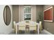 Elegant dining room features stylish furniture and abundant natural light at 23398 W Sonrisas St, Buckeye, AZ 85326