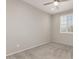 Light and airy bedroom featuring carpet, a ceiling fan, and a window with shutters at 26753 W Zachary Dr, Buckeye, AZ 85396