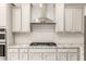Modern kitchen featuring stainless gas range and marble countertops at 26753 W Zachary Dr, Buckeye, AZ 85396