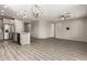 Spacious living room featuring hardwood floors, recessed lighting, and neutral paint at 26753 W Zachary Dr, Buckeye, AZ 85396