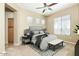A well-lit bedroom with a ceiling fan, a bed, and a doorway that goes into another room at 2989 N 44Th N St # 2007, Phoenix, AZ 85018