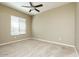 An empty bedroom with neutral carpeting and a large window at 2989 N 44Th N St # 2007, Phoenix, AZ 85018