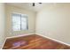 A well-lit bedroom with hardwood floors and a view from the window at 2989 N 44Th N St # 2007, Phoenix, AZ 85018