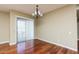 Living room featuring hardwood floors, neutral walls, and sliding glass doors that fill the space with natural light at 2989 N 44Th N St # 2007, Phoenix, AZ 85018