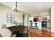 Open-concept living area with hardwood floors, dining space, and kitchen with an island at 2989 N 44Th N St # 2007, Phoenix, AZ 85018