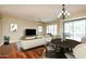 Spacious living room with an open floor plan and hardwood floors, including a chandelier over a dining table at 2989 N 44Th N St # 2007, Phoenix, AZ 85018