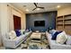 Comfortable clubhouse lounge area with plush sofas, accent pillows, and a modern ceiling fan at 2989 N 44Th N St # 2007, Phoenix, AZ 85018