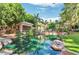 Picturesque pond surrounded by lush greenery, mature trees and a covered patio area at 2989 N 44Th N St # 2007, Phoenix, AZ 85018