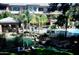 Community pool area featuring a pool, jacuzzi, lounge chairs, patio and pond at 2989 N 44Th N St # 2007, Phoenix, AZ 85018