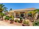Well-kept backyard with covered patio, sliding glass door, and beautiful foliage at 3166 N 158Th Ave, Goodyear, AZ 85395