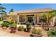 Well-maintained covered back patio with outdoor furniture and landscaping at 3166 N 158Th Ave, Goodyear, AZ 85395