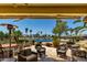 Inviting covered patio with comfortable seating, perfect for enjoying the scenic water view and landscaping at 3166 N 158Th Ave, Goodyear, AZ 85395