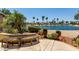 Scenic backyard featuring a tranquil lake view and lush landscaping at 3166 N 158Th Ave, Goodyear, AZ 85395