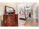 Elegant bedroom with a dresser and view into a king bedroom featuring natural light at 3166 N 158Th Ave, Goodyear, AZ 85395